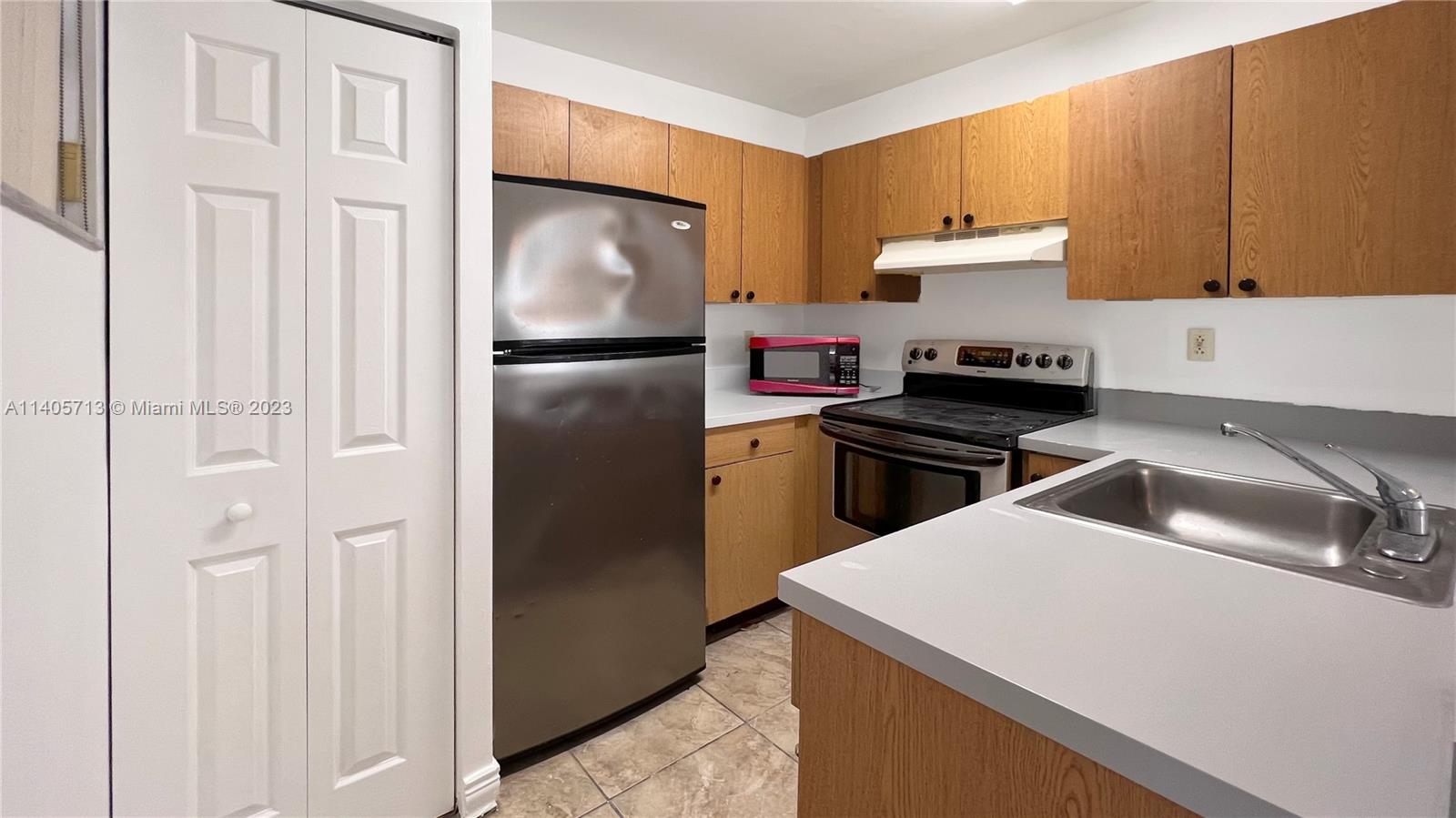 The Hammocks Miami, FL 33196 - Photo 9 of 20 a kitchen with a refrigerator stove and sink