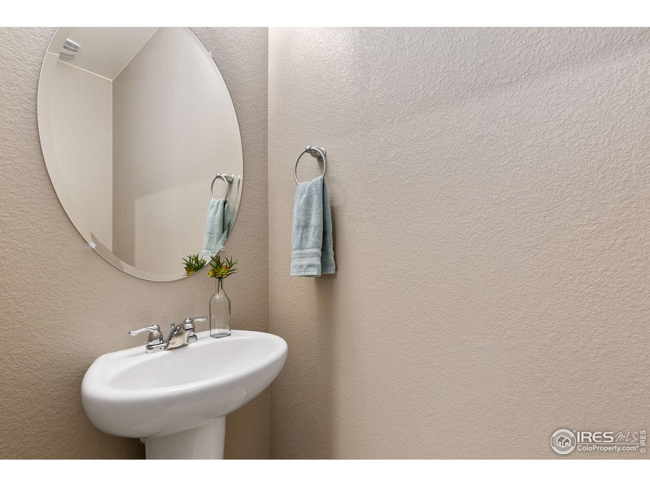 1270 Wild Basin Road Severance, CO 80550 - Photo 12 of 34 Half bathroom with LOTS of nearby storage in the main-level hallway