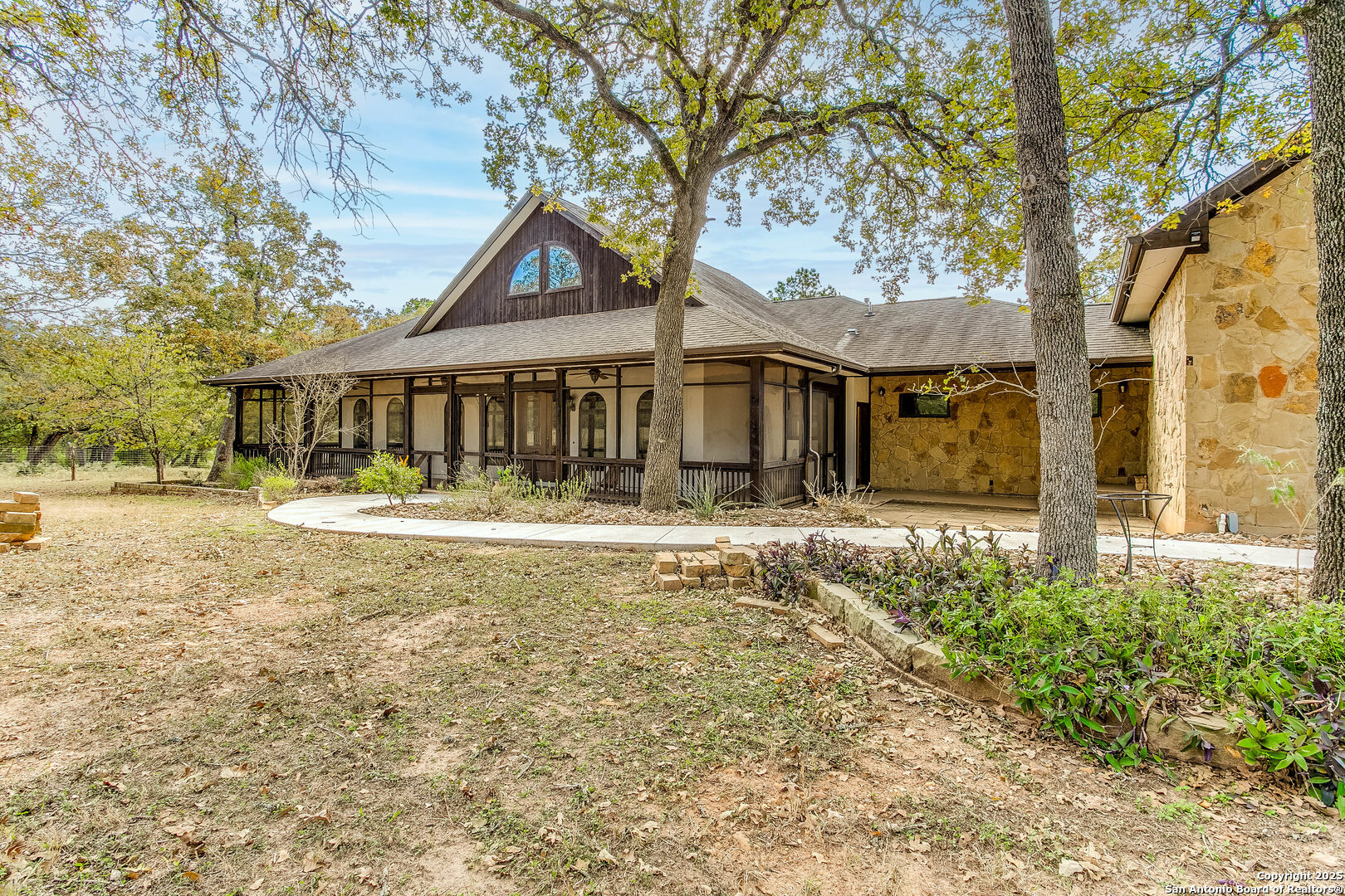 408 Copeland Hill Road Smithville, TX 78957 - Photo 2 of 35 a front view of a house with a yard table and chairs