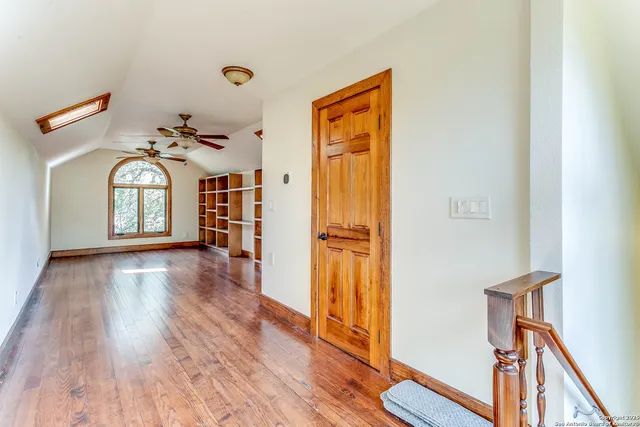 a view of livingroom with hardwood floor and hallway