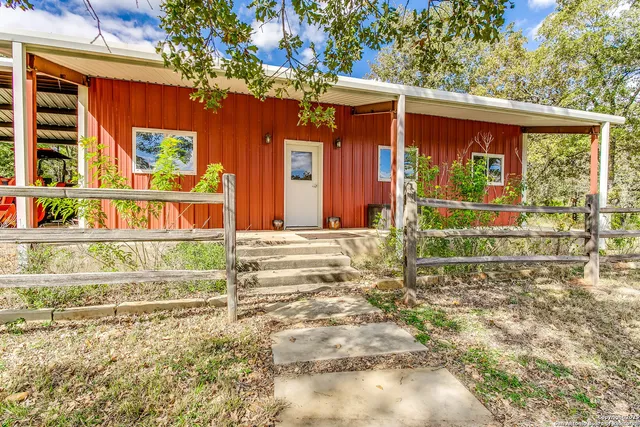 front view of a house with a large window
