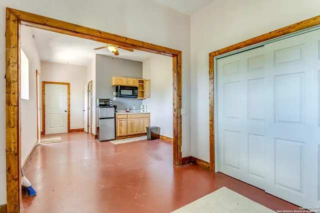 a view of a hallway with a living room