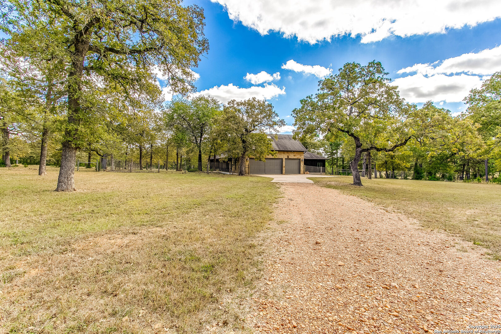 408 Copeland Hill Road Smithville, TX 78957 - Photo 35 of 35 a backyard of a house with lots of green space