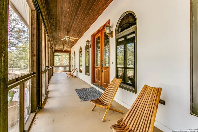 a view of an chairs and table in balcony