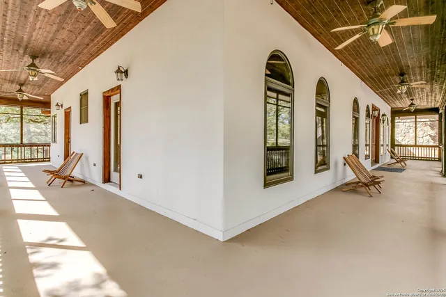 a view of a livingroom with furniture and windows