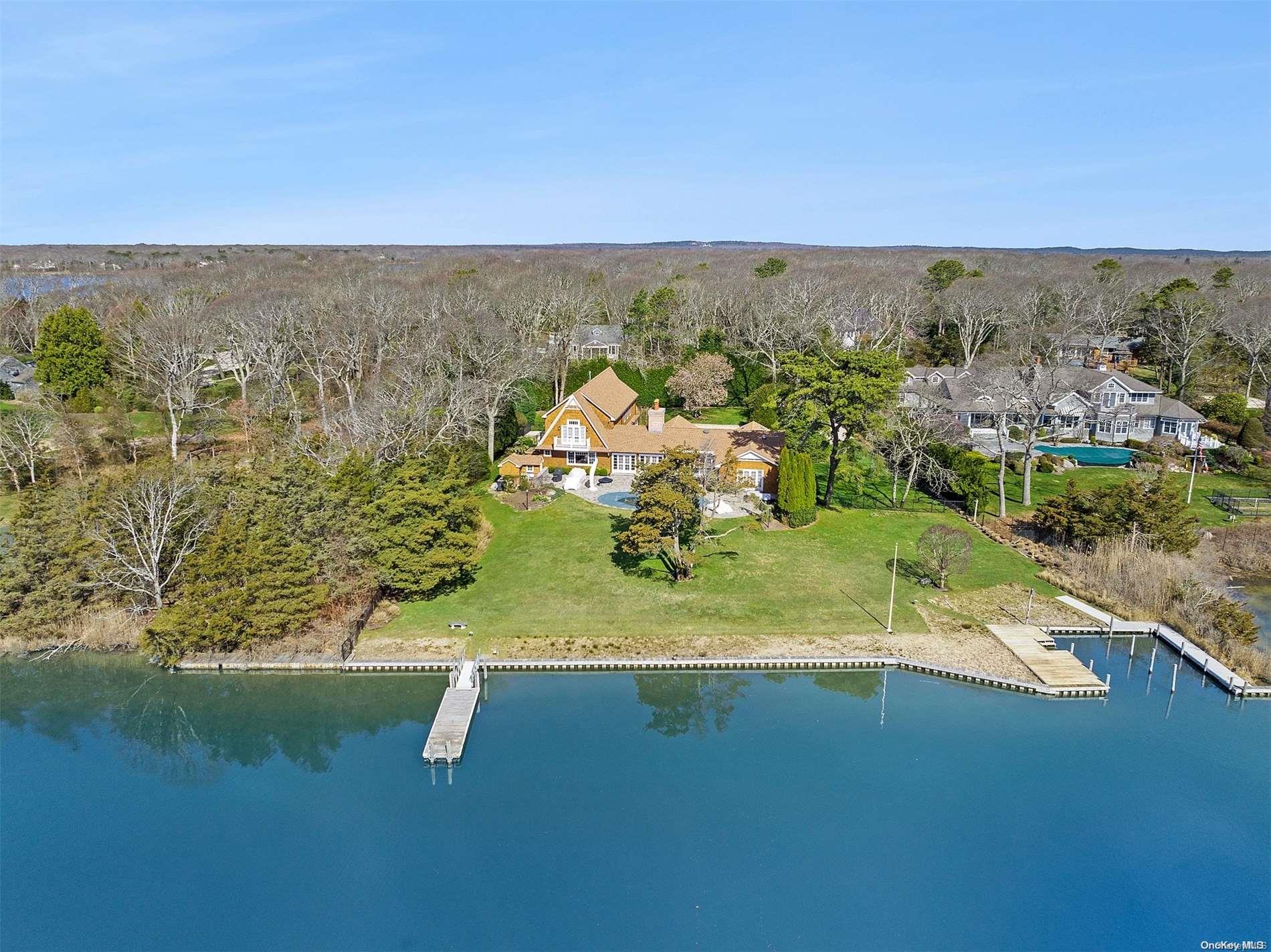 58 Cedar Lane Remsenburg, NY 11960 - Photo 1 of 1 an aerial view of a houses with a lake