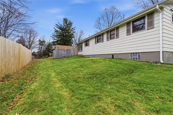 a view of a house with a back yard