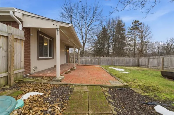 a view of a backyard of the house