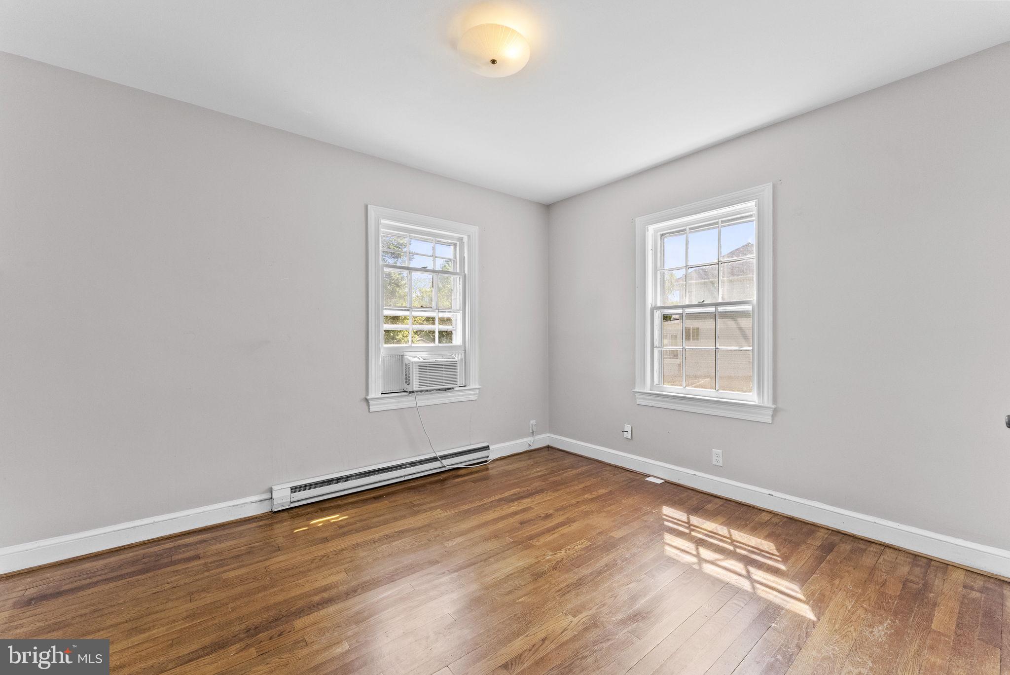 539 Old Meetze Road Warrenton, VA 20186 - Photo 11 of 30 an empty room with wooden floor and windows