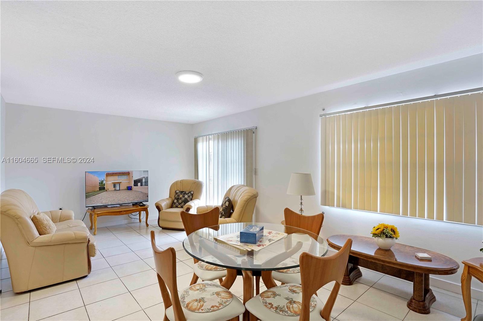 624 Northwest 11th Street Miami, FL 33136 - Photo 12 of 26 a living room with furniture and a window