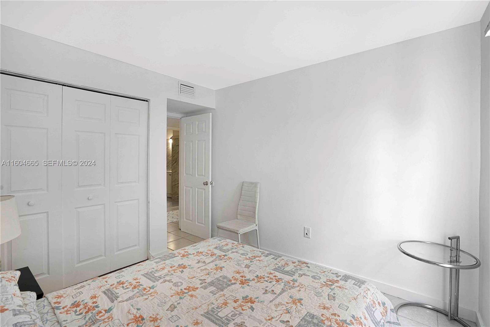 624 Northwest 11th Street Miami, FL 33136 - Photo 13 of 26 a bedroom with a bed and a bathroom in it