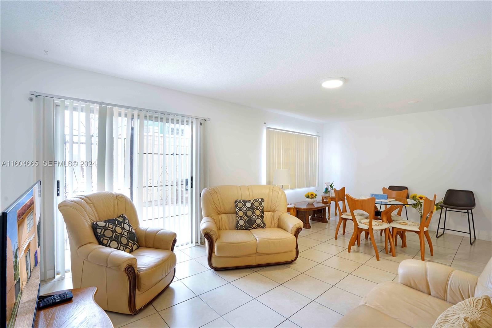 624 Northwest 11th Street Miami, FL 33136 - Photo 23 of 26 a living room with furniture and a large window with outer view