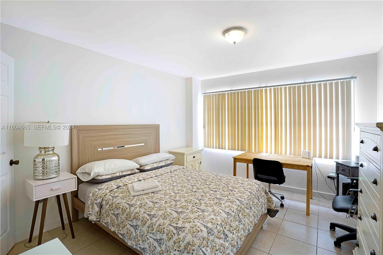 624 Northwest 11th Street Miami, FL 33136 - Photo 25 of 26 a bedroom with a bed and wooden furniture