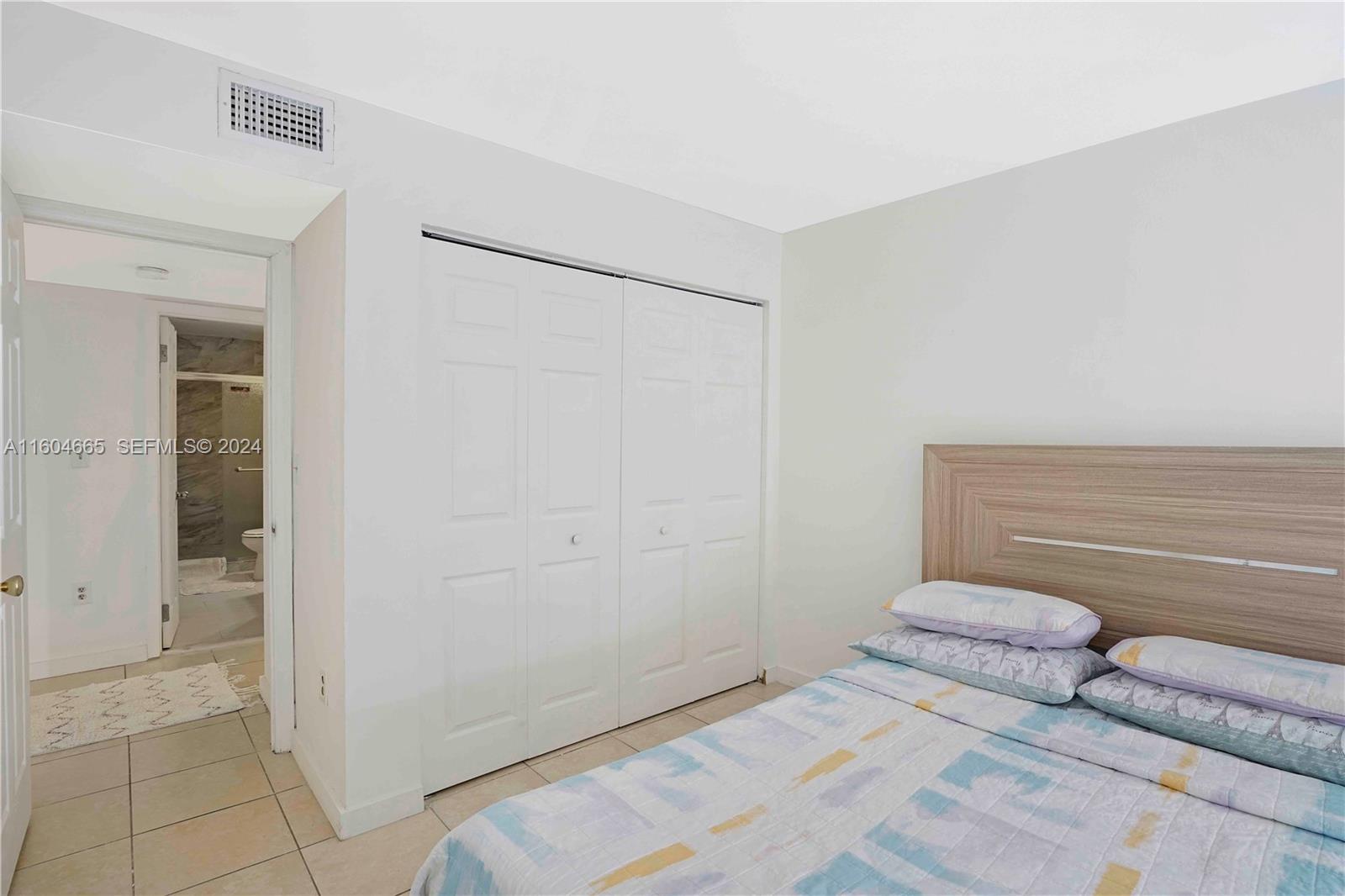 624 Northwest 11th Street Miami, FL 33136 - Photo 10 of 26 a bedroom with a bed and a shower