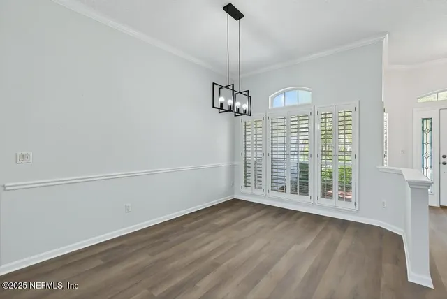 a large kitchen with a stove and refrigerator