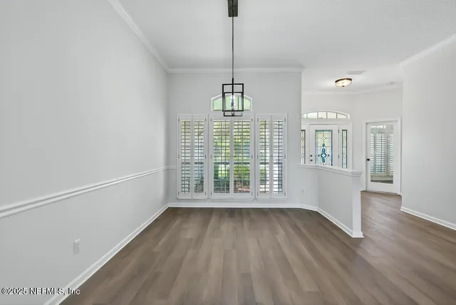 a kitchen with cabinets a sink and a stove top oven