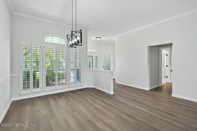 a kitchen with sink a stove and cabinets