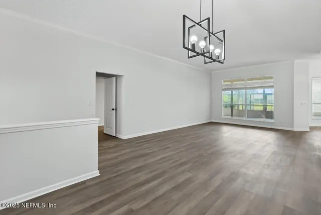 a kitchen with granite countertop white cabinets stainless steel appliances and sink