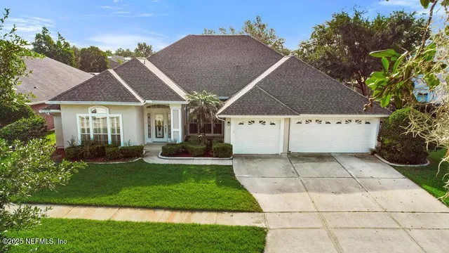 a view of house with yard