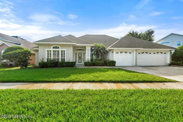a front view of a house with garden