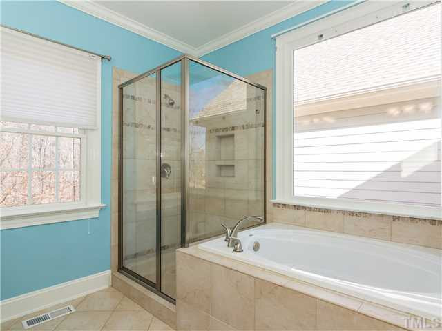 8677 Barrett Ridge Road Wake Forest, NC 27587 - Photo 14 of 25 It's so nice to have a garden tub and separate shower. You have your own spa without leaving home! You will really enjoy having a walk-in closet in the master suite. There is new carpet in the master closet as well! Master Bath/Spa