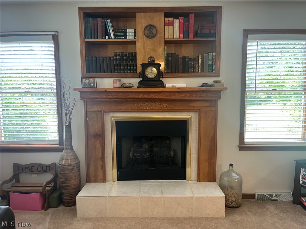 9449 Old State Road Chardon, OH 44024 - Photo 16 of 39 gas fireplace built in bookcase over mantle