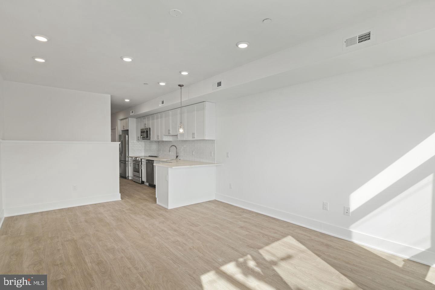 2721 Federal Street, Unit 3 Philadelphia, PA 19146 - Photo 5 of 22 a view of a kitchen with wooden floor