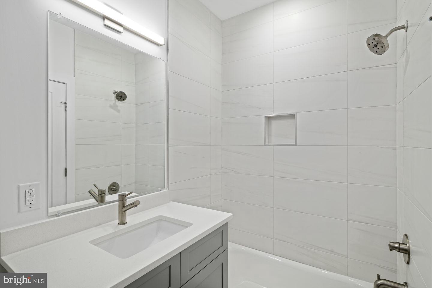 2721 Federal Street, Unit 3 Philadelphia, PA 19146 - Photo 9 of 22 a bathroom with a sink shower and a mirror