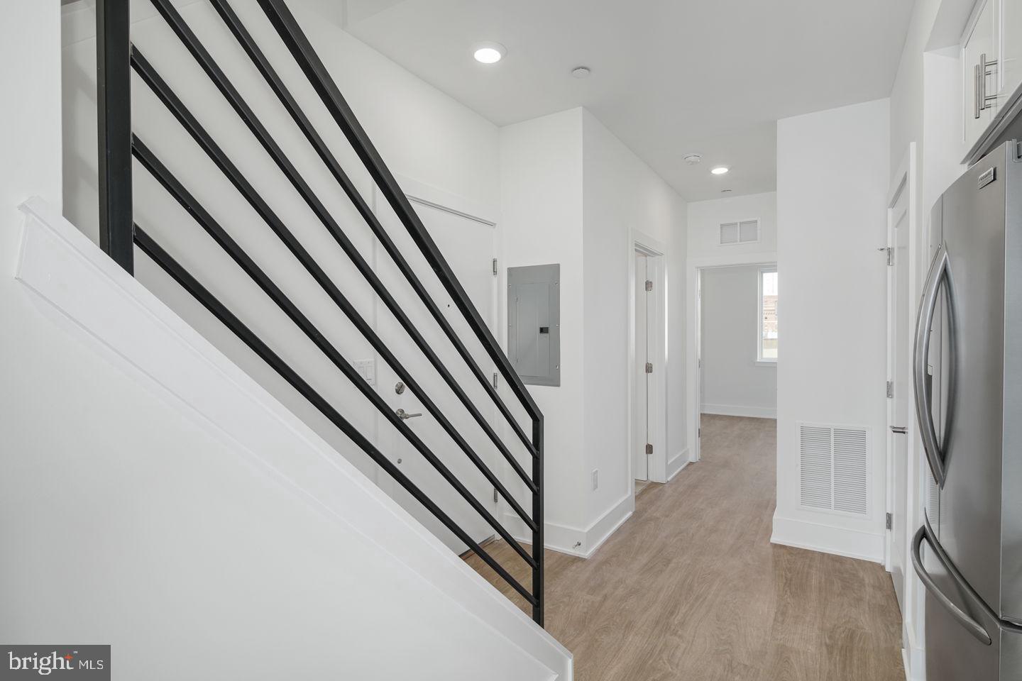 2721 Federal Street, Unit 3 Philadelphia, PA 19146 - Photo 10 of 22 a view of a hallway with wooden floor and staircase