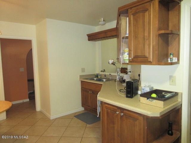 1022 Via Independencia Rio Rico, AZ 85648 - Photo 15 of 41 a kitchen with a sink and a cabinets