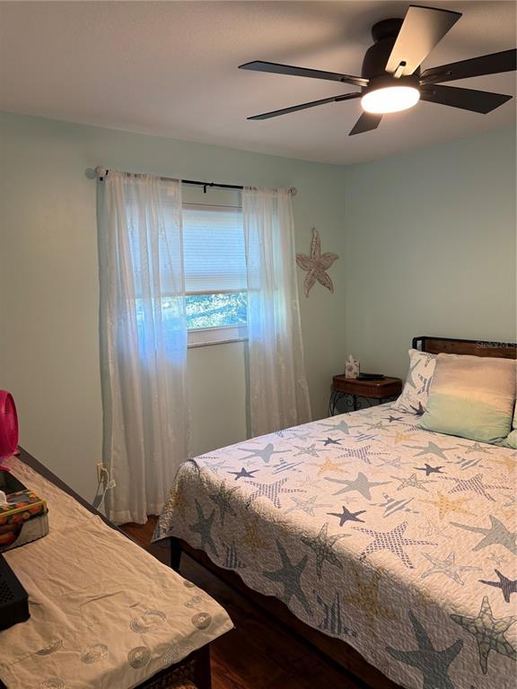 14531 Walsingham Road, Unit 224 Largo, FL 33774 - Photo 25 of 41 a bedroom with a bed and a window