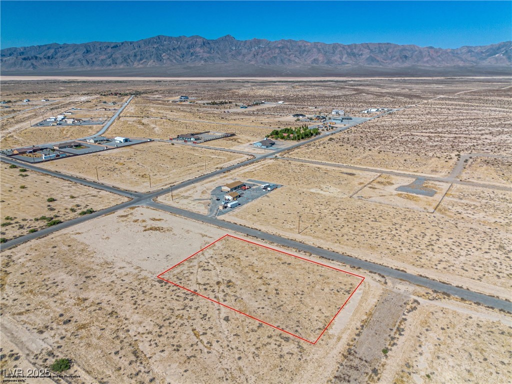 2021 Ricky Road Pahrump, NV 89048 - Photo 9 of 16 Drone photo from the end of the Ricky Rd cul-de-sac with the property parcel highlighted