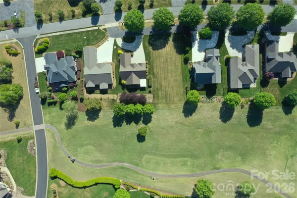 an aerial view of residential house with an outdoor space