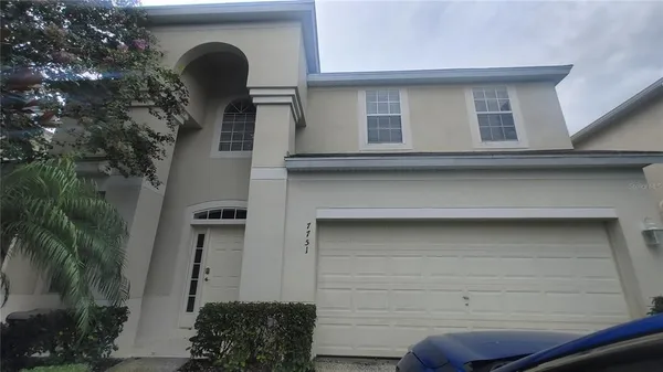 a front view of a house with garage