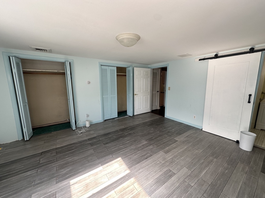 101 Hackensack Road Boston, MA 02467 - Photo 15 of 33 a view of a livingroom with wooden floor