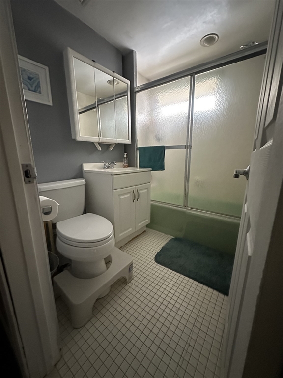 101 Hackensack Road Boston, MA 02467 - Photo 23 of 33 a bathroom with a toilet a sink and mirror