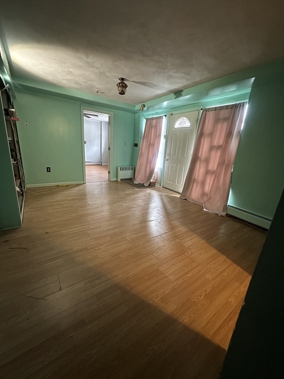 101 Hackensack Road Boston, MA 02467 - Photo 26 of 33 a view of an empty room with window and stairs