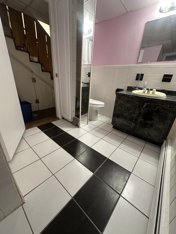 101 Hackensack Road Boston, MA 02467 - Photo 29 of 33 a bedroom with a bed and a cabinets