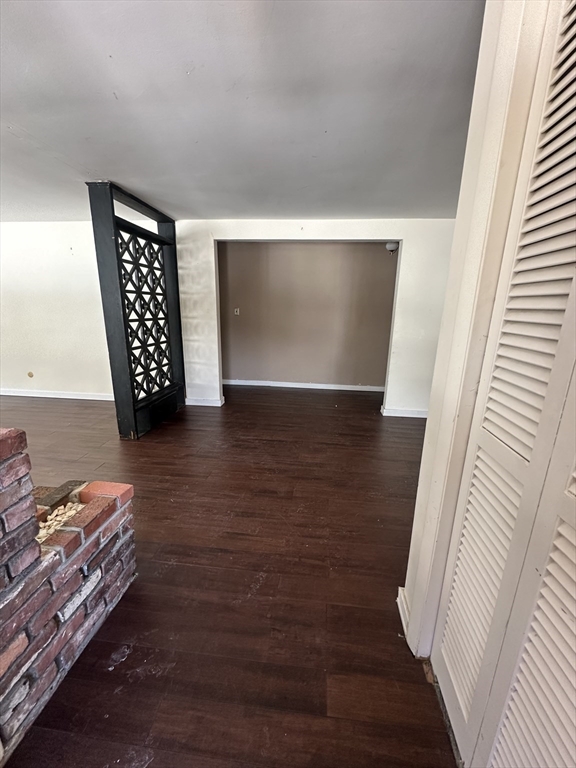 101 Hackensack Road Boston, MA 02467 - Photo 7 of 33 a view of an empty room with wooden floor