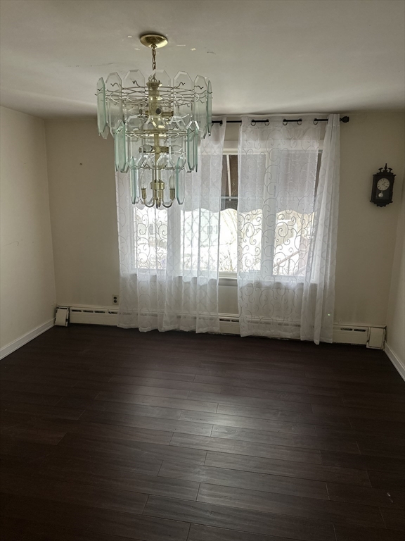 101 Hackensack Road Boston, MA 02467 - Photo 9 of 33 a view of a room with wooden floor and windows