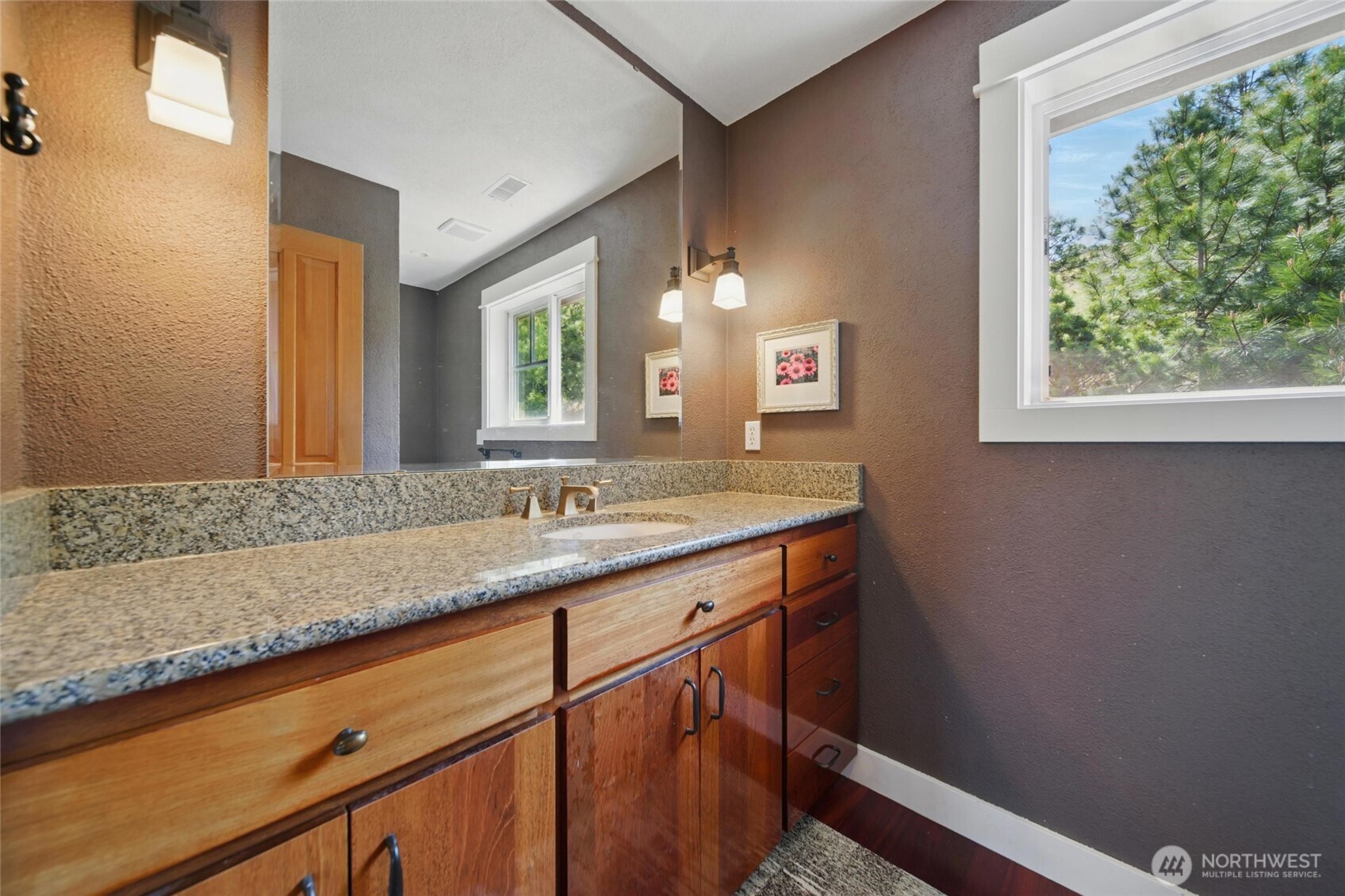 469 Tag Lane Walla Walla, WA 99362 - Photo 23 of 40 a bathroom with a granite countertop sink a mirror and a window