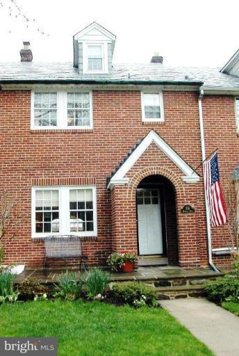 316 Murdock Road Baltimore, MD 21212 - Photo 1 of 25 a front view of a house with a garden and plants