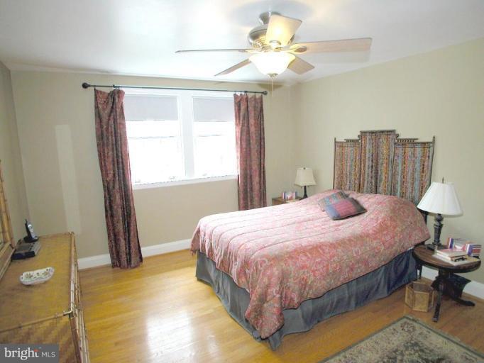 316 Murdock Road Baltimore, MD 21212 - Photo 16 of 25 a bedroom with a bed chandelier and a window