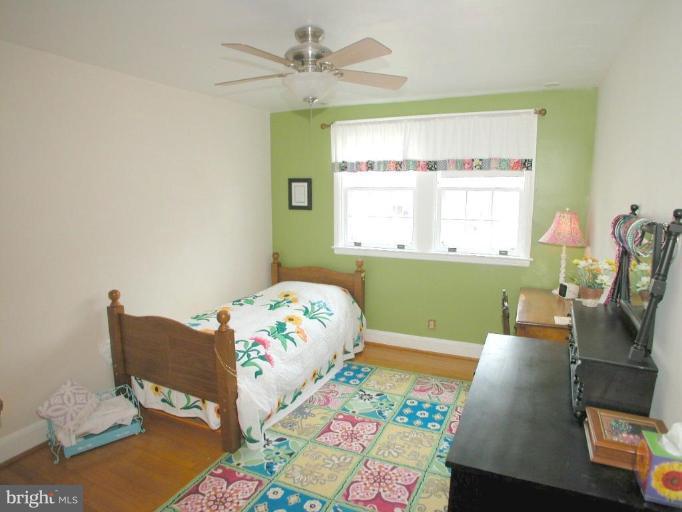 316 Murdock Road Baltimore, MD 21212 - Photo 18 of 25 a bedroom with furniture and a window