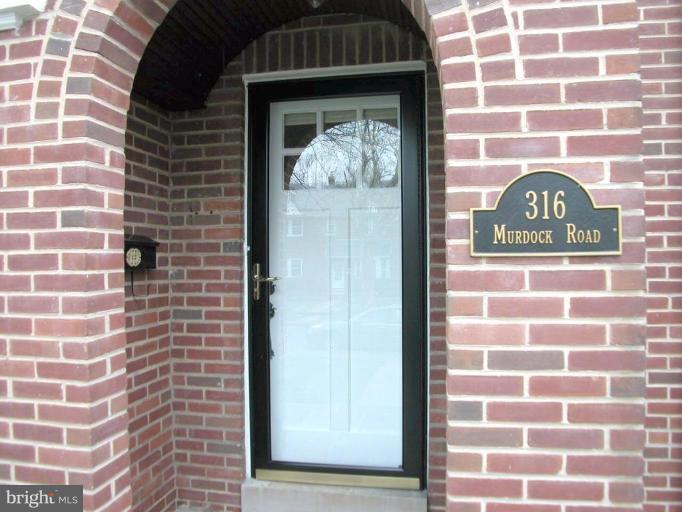 316 Murdock Road Baltimore, MD 21212 - Photo 3 of 25 a view of a door and brick wall