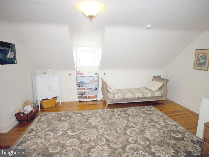 316 Murdock Road Baltimore, MD 21212 - Photo 21 of 25 a bedroom with a bed and a dresser