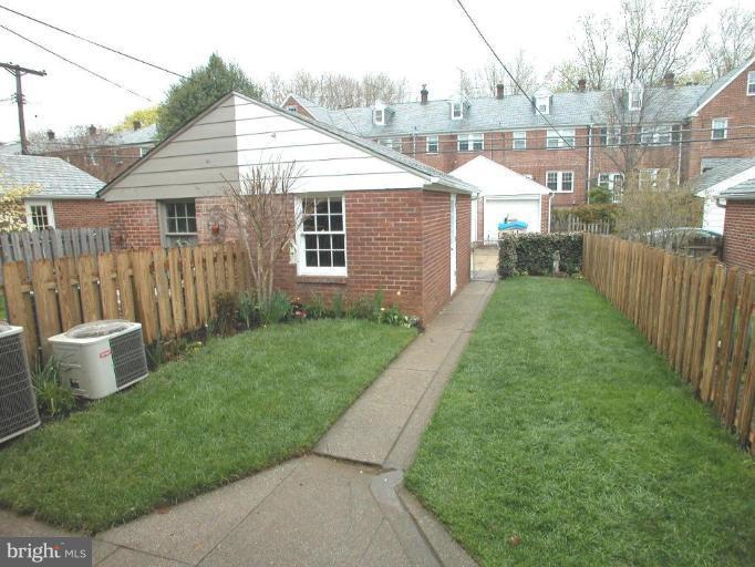 316 Murdock Road Baltimore, MD 21212 - Photo 22 of 25 a front view of a house with a yard