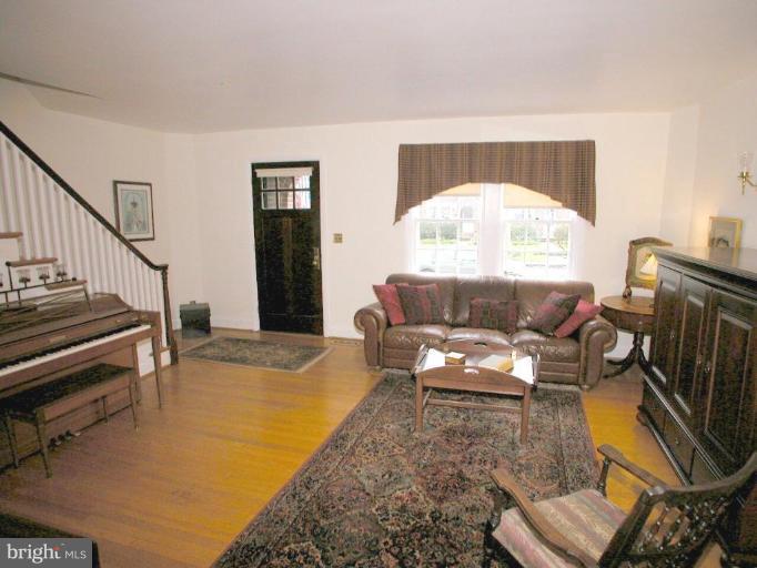 316 Murdock Road Baltimore, MD 21212 - Photo 4 of 25 a living room with furniture and a fireplace
