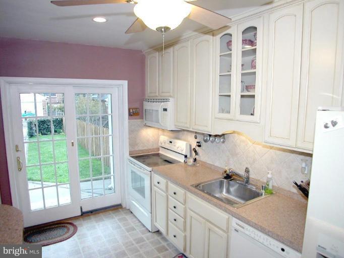 316 Murdock Road Baltimore, MD 21212 - Photo 9 of 25 a kitchen with a sink window and cabinets