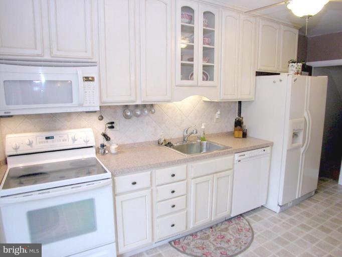 316 Murdock Road Baltimore, MD 21212 - Photo 10 of 25 a kitchen with cabinets appliances and a counter space